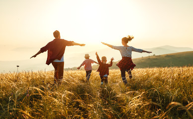 family running through field